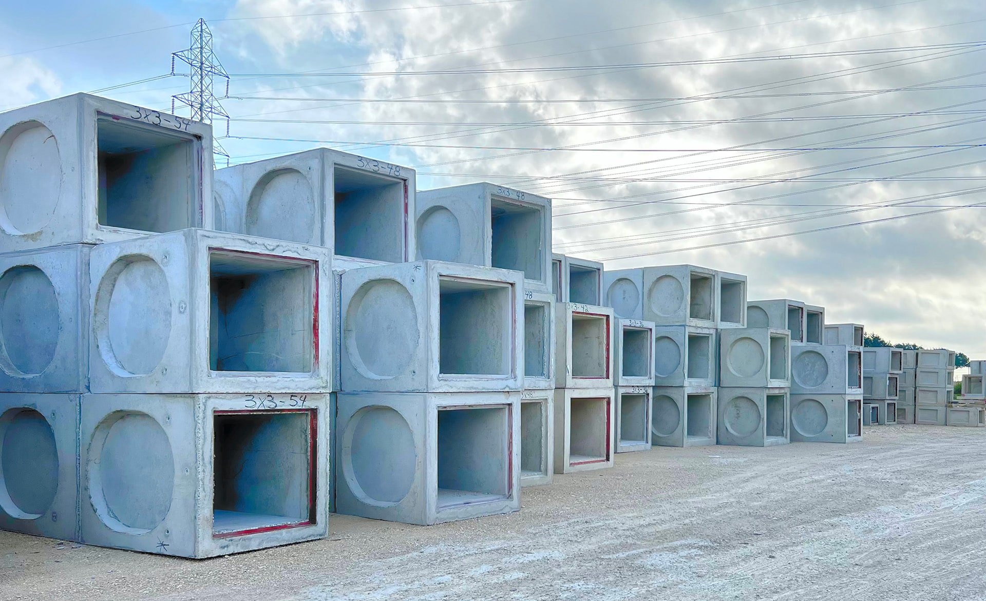 concrete boxes stacked in an outdoor area