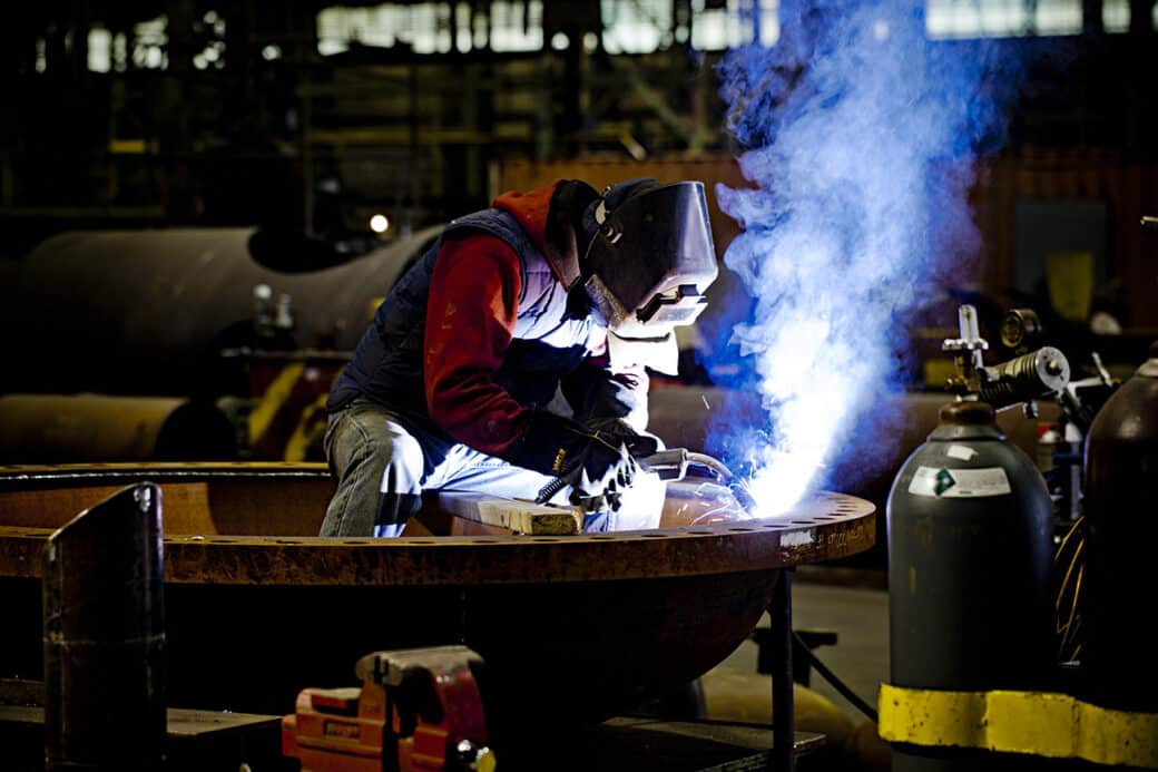 welder in workshop welding