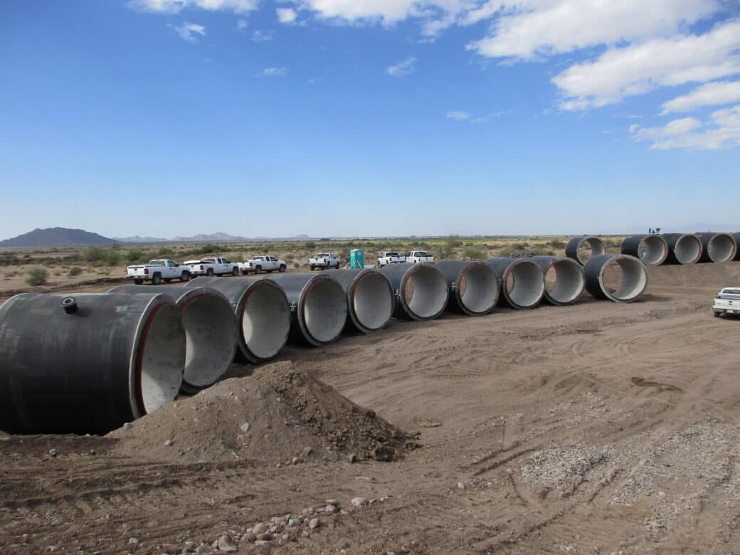 pipes staged in field