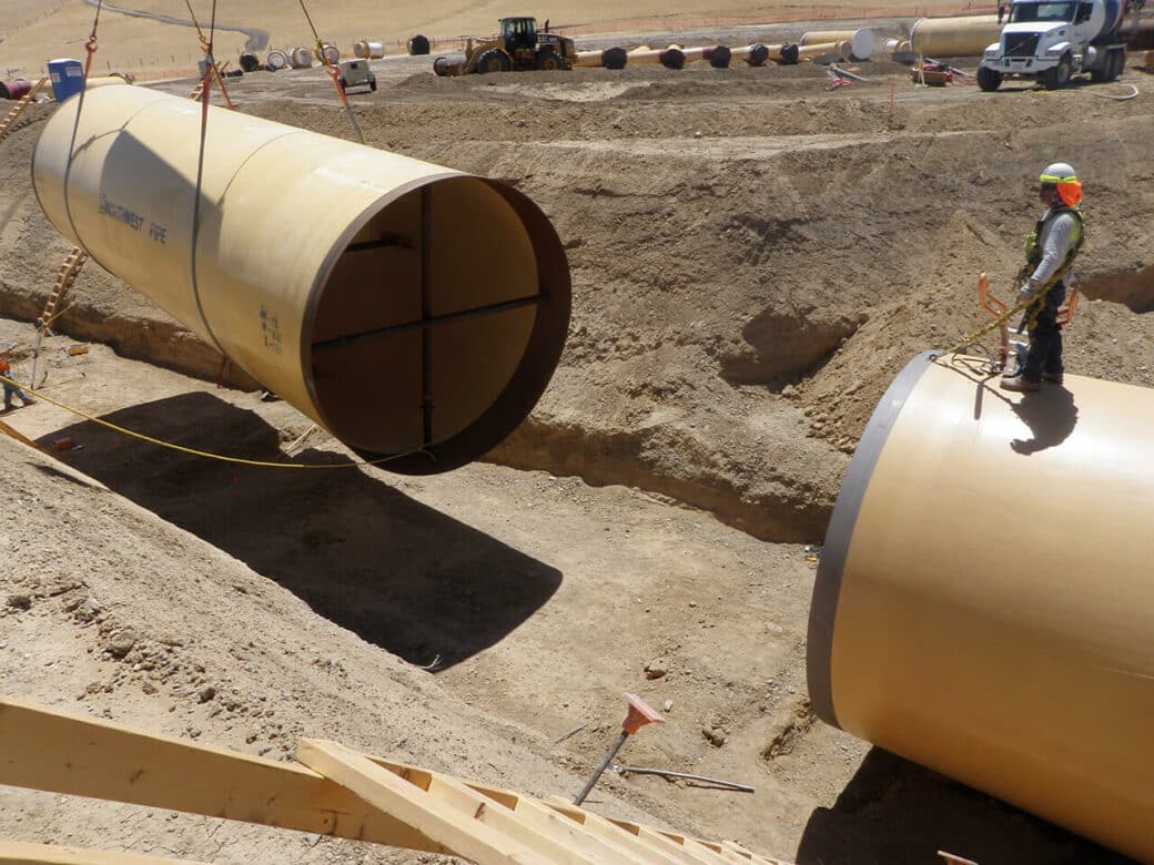 applications water transmission pipes being placed