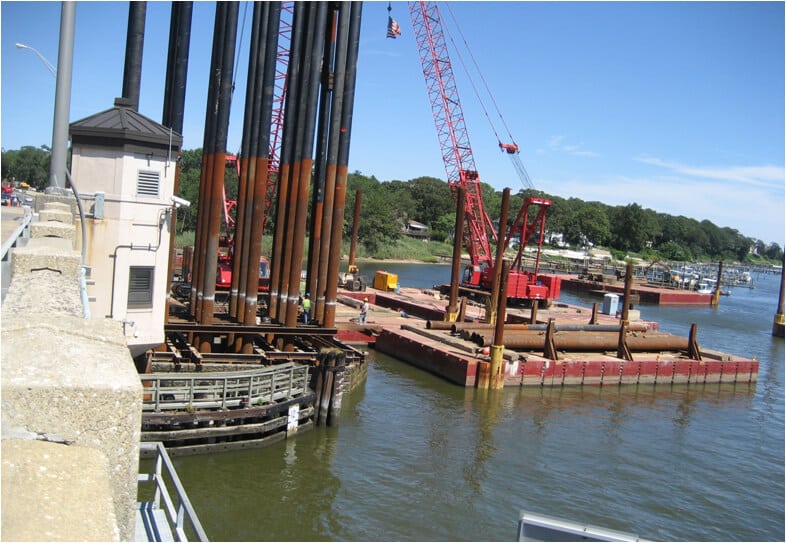 products piling  red crane in water