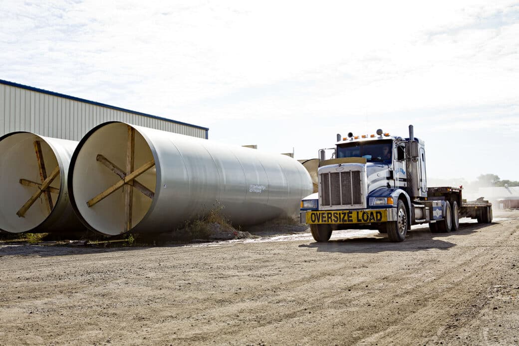 semi truck and large pipes