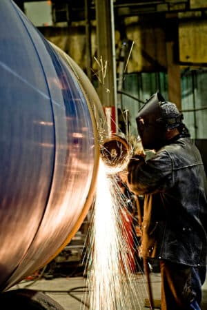 guy cutting sparks flying