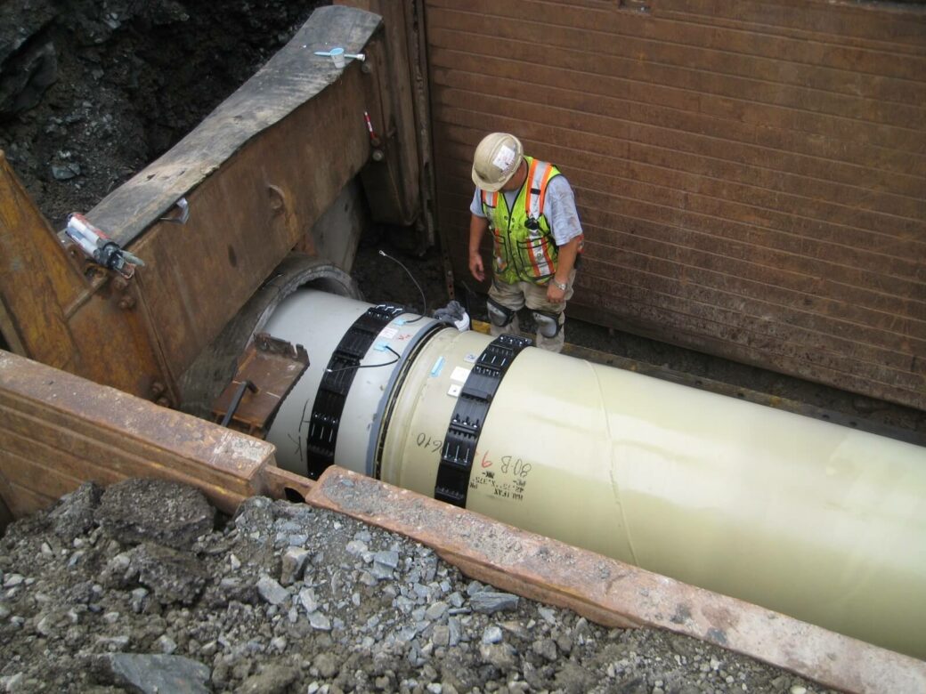 kearney man adjusting pipe