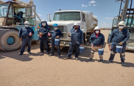 Northwest Pipe Company employees in SLRC Mexico holding water jugs