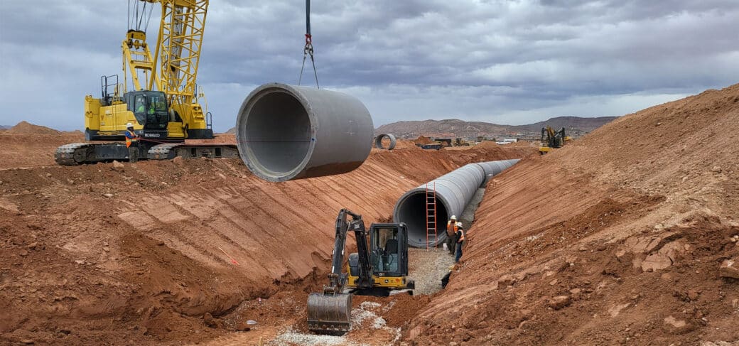 96-inch RCP being placed by crane into trench