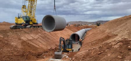 96-inch RCP being placed by crane into trench