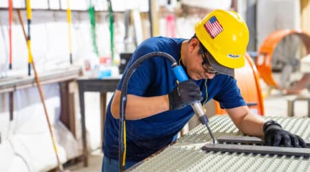 Man welding plastic liner